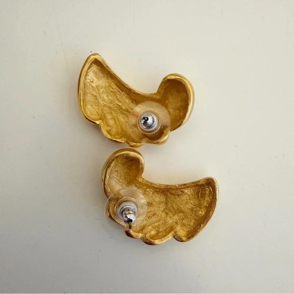 Vintage gold-plated, fluted, or ribbed wave design earrings.